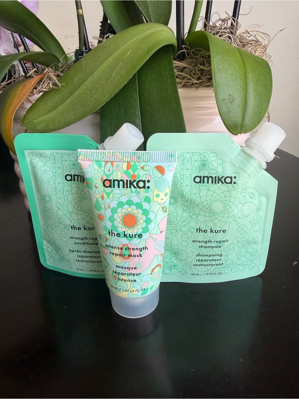 amika The Kure Strength Repair Set — Mint Green Floral Packaging